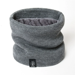 Detail of gray winter neck warmer showing thick knit texture and soft fleece lining