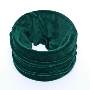 Close-up of velvet neck warmer in dark green with soft plush texture and ring design