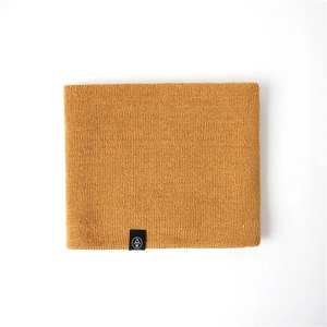 Detail of ginger yellow knitted neck warmer showing smooth weave texture and woven label