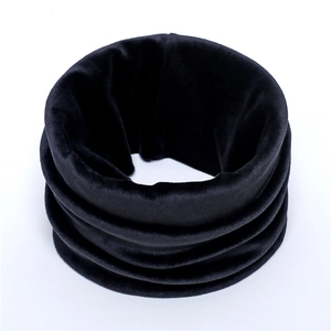 Close-up of black velvet neck warmer showing soft fabric texture and warm lining