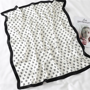 Elegant white satin square scarf with black letter D pattern and contrasting borders