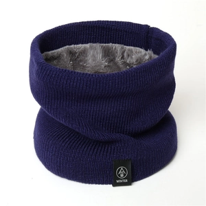 Detail showing the thick navy blue knit outer and soft grey fleece lining of the snood