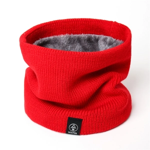 Close-up of winter neck warmer with red ribbed knit and thick grey fleece lining