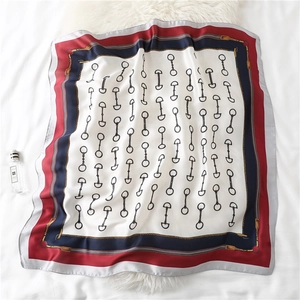 Classic equestrian style square silk scarf with red, blue, and white bit pattern design