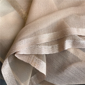 Detailed macro view of champagne silk wool scarf with gold lurex stripes and woven edges