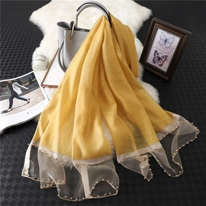 Ginger yellow silk wool shawl with sheer mesh borders and delicate pearl embellishments