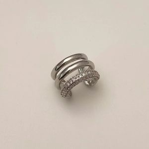 Detail of silver triple-layered ear cuff featuring sparkling cubic zirconia stones
