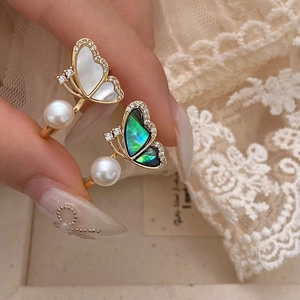 Elegant adjustable ring with shell butterfly, fresh water pearl, and sparkling crystals