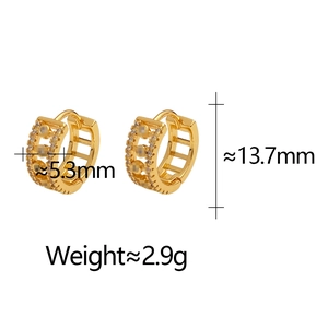 Close-up of gold-plated hoop earrings with micro-set cubic zirconia and hollow design