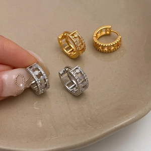Luxe micro-paved cubic zirconia huggie earrings in gold and silver hollow-out design