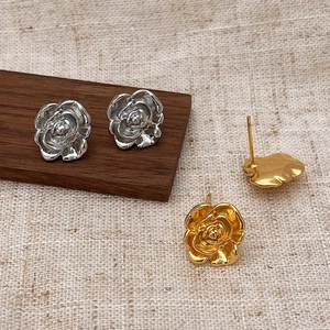 Vintage camellia rose stud earrings in gold and silver finish with detailed petals