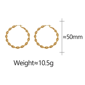Macro detail of 50mm gold-plated twisted hoop earrings with weight specifications