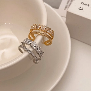Adjustable double-layered rings with sparkling cubic zirconia in gold and silver finish