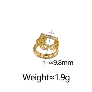 Detail view of gold horsebit ring with inset crystals and 9.8mm size dimension