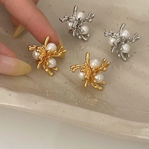 Elegant gold and silver firework pearl stud earrings with branching metal design