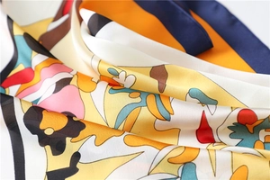 Detailed view of colorful abstract geometric pattern on silky 70cm satin square scarf