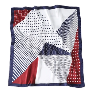 Polka dot and geometric striped silk scarf in classic red, white, and blue colors