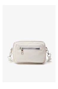 Detail view of white PU leather crossbody bag featuring silver zippers and adjustable strap
