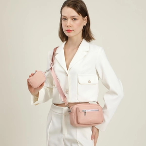 Pink minimalist crossbody camera bag for women with matching coin purse and wide strap