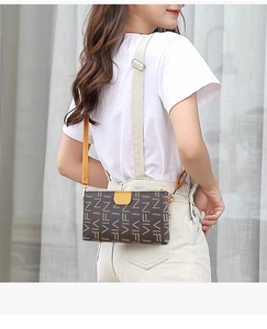 Detail view of stylish crossbody bag with contrast yellow strap and VIFN letter print