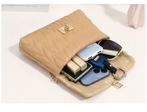 Interior view showing the large capacity of the quilted chain crossbody bag for essentials