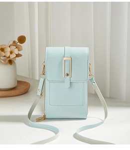 Detail of baby blue crossbody phone bag with gold metal buckle and adjustable strap