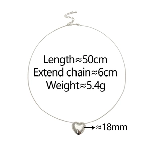 Detail of silver heart pendant with size specs 50cm length and 18mm width on white background