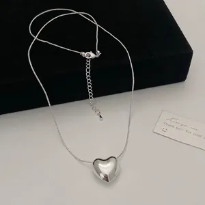 Minimalist silver heart pendant necklace with sleek snake chain and lobster clasp