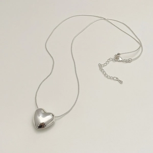 Polished silver heart pendant necklace with adjustable lobster clasp and snake chain link