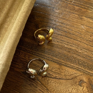 Elegant gold and silver teardrop open rings with smooth organic fluid design