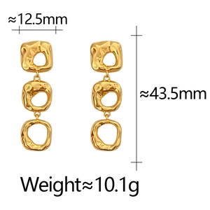 Detail view of irregular gold hollow earrings showing dimensions 12.5mm by 43.5mm