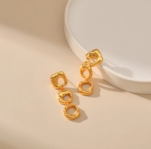 Minimalist gold hollow irregular metal drop earrings with organic molten lava texture