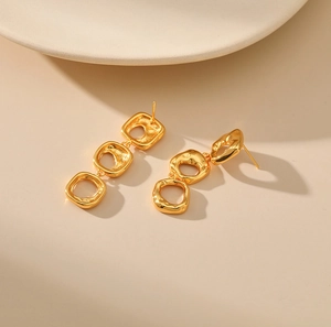Modern gold irregular hollowed-out square earrings with hammered liquid metal texture