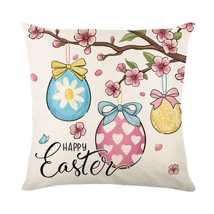 Easter throw pillow cover featuring pink cherry blossoms and painted eggs on white background