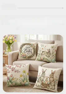 Detail of four Easter throw pillow covers with rabbit and flower prints on a beige sofa