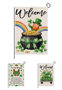 Detail of St. Patrick's Day garden flags with leprechaun, shamrock and truck prints