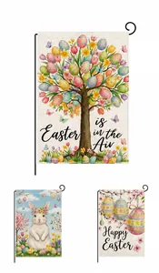 Detail of Easter garden flags showing burlap texture and rabbit egg festive designs