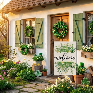 Welcome St. Patrick's Day garden flag with green shamrock wreath in a sunny patio