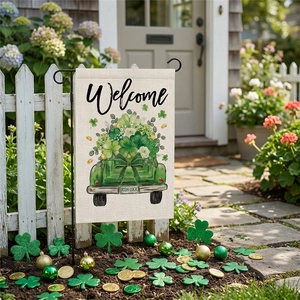 St. Patrick's Day garden flag with green truck and shamrocks on white wood background