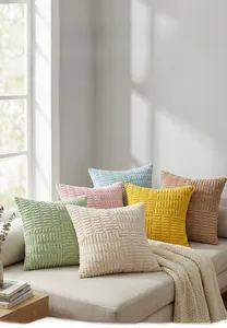 Detailed view of striped corduroy cushion covers in pastel tones on a modern sofa