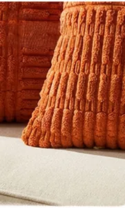 Detailed texture of orange corduroy pillow cover with high-quality invisible zipper