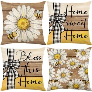 Set of 4 rustic cushion covers featuring daisies, bees, and wood grain prints