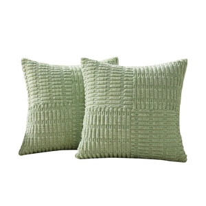 Set of two light green corduroy pillow covers with a cross-textured checkered pattern