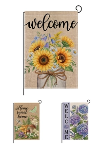Detail of linen texture and double-sided floral print on a welcome garden flag