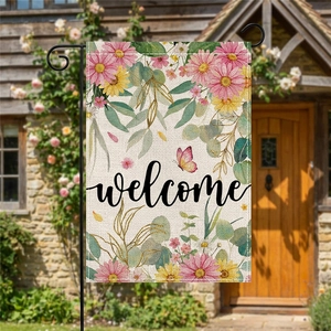Double sided floral welcome garden flag with daisies and butterfly on a black metal stand