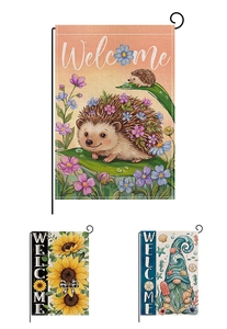 Detailed view of linen garden flags with sunflower and gnome prints on metal hooks