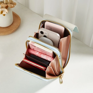 Light blue lychee pattern crossbody phone bag with multi-layer zipper compartments