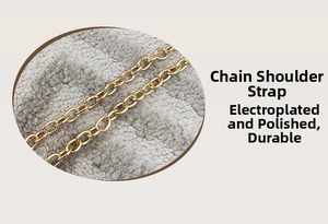 Detailed macro view of gold metal chain shoulder strap with polished electroplated finish