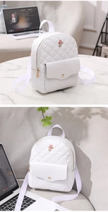 Detailed view of white quilted PU leather backpack with a 3D pink rose accessory