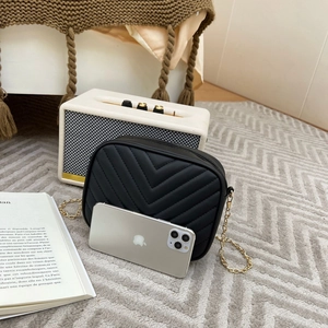 Chic black quilted crossbody camera bag with golden chain strap for modern women